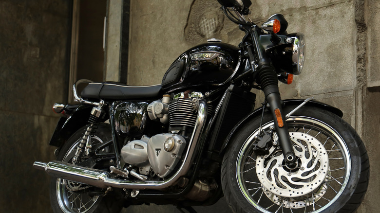 A black Triumph Trident classic motorcycle