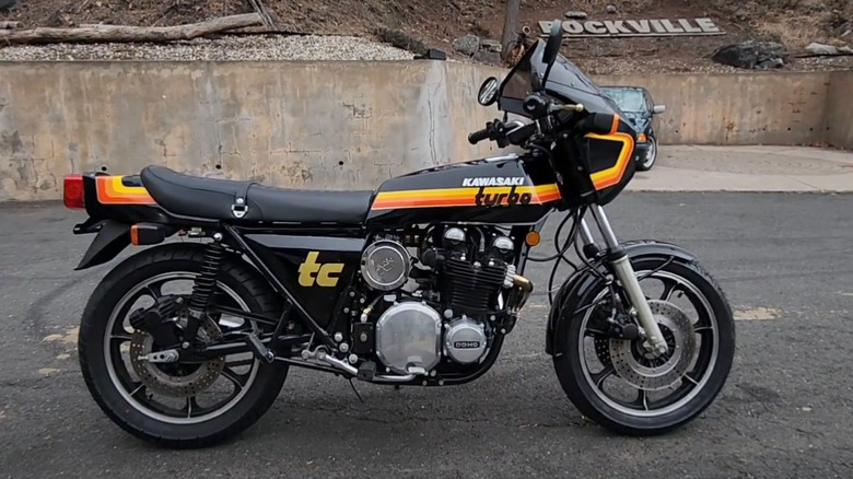 Rare 1978 Kawasaki Z1R-TC Turbo in black with retro orange and yellow striping, parked in front of a "Rockville" sign backdrop.