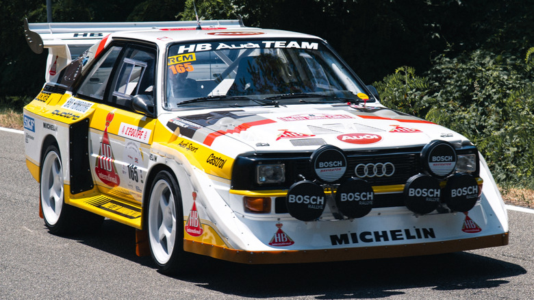 Audi Quattro covered in race car advertisements