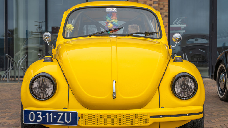Yellow Volkswagen Beetle viewed from the front
