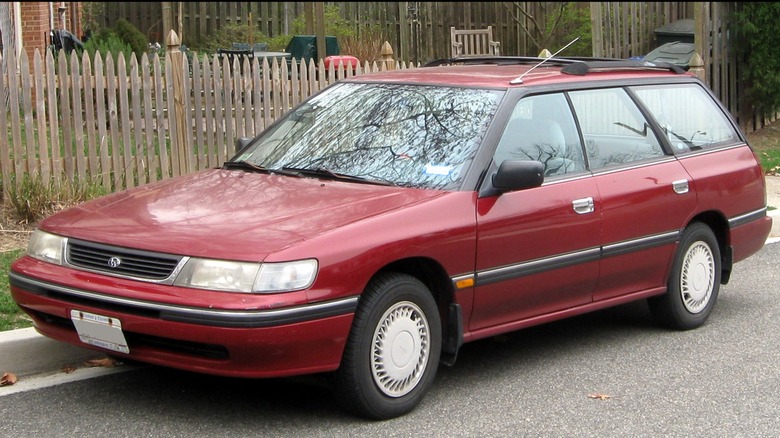 Red Subaru Outback parked on street