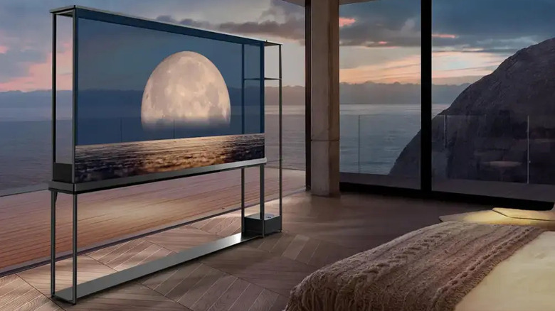 LG Signature OLED T at dusk showing the moon through its transparent screen