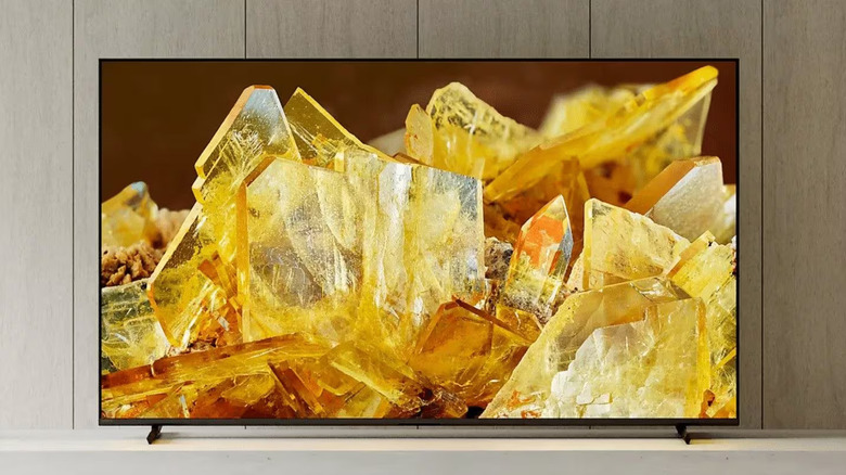 Sony BRAVIA TV on itis stand by a wall