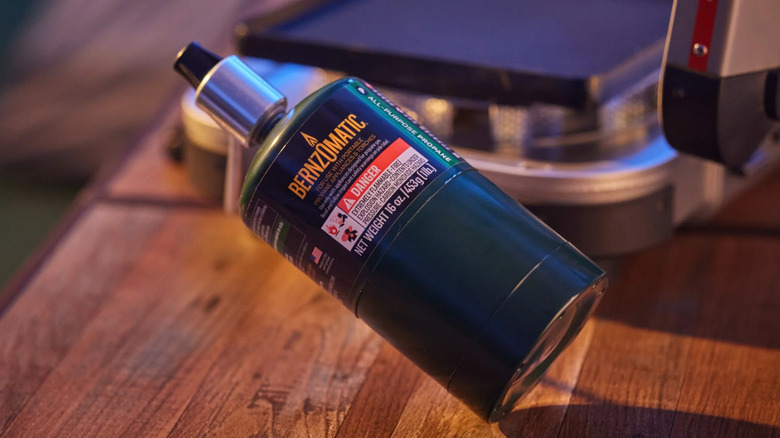 The BernzOmatic All-Purpose Propane Fuel Cylinder lying on a wooden surface