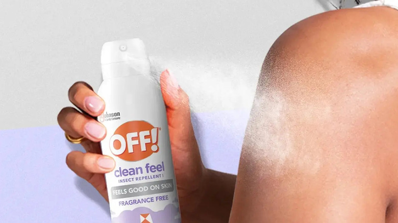 A person using the OFF! Clean Feel Aerosol insect spray on their shoulder
