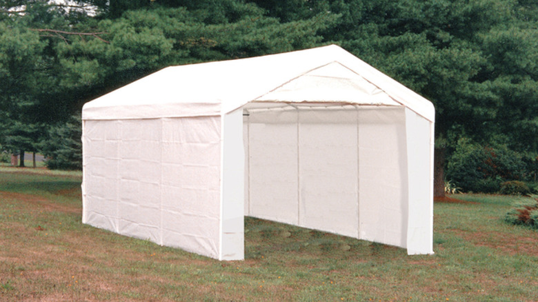 The ShelterLogic Max AP 3-in-1 Backyard Canopy Pack pitched in the yard