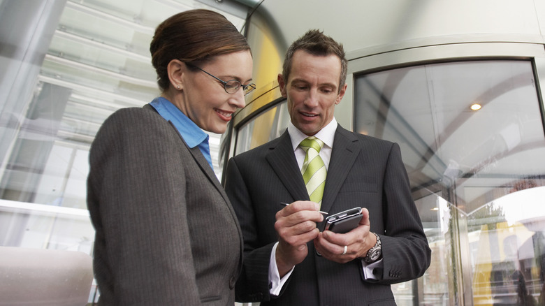 business people with PDA
