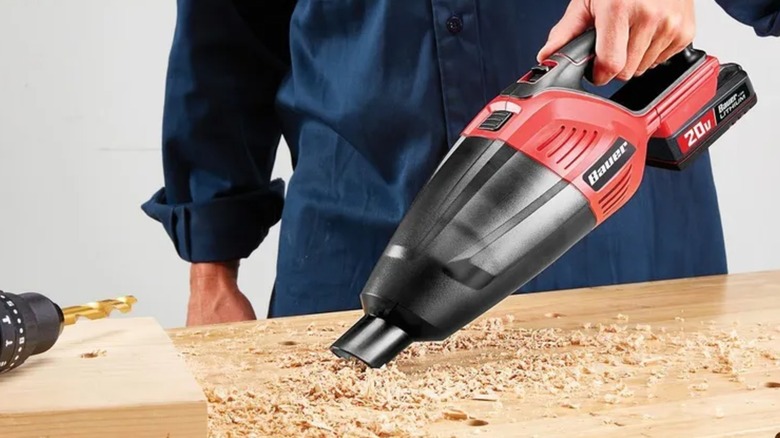 cleaning up workshop debris with Bauer vacuum