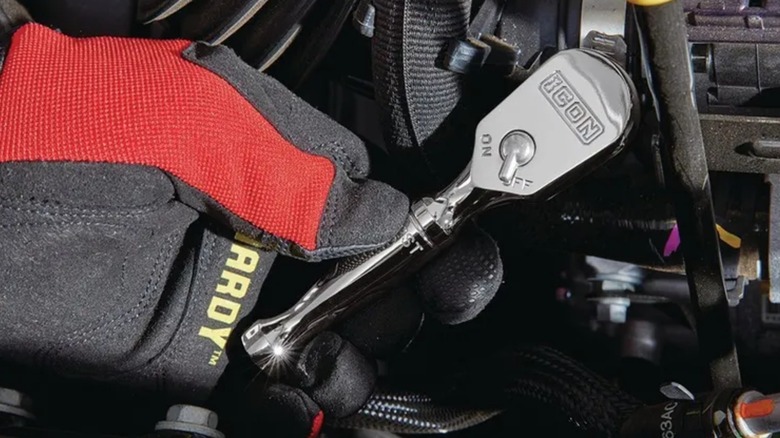 using small Icon ratchet for a car repair