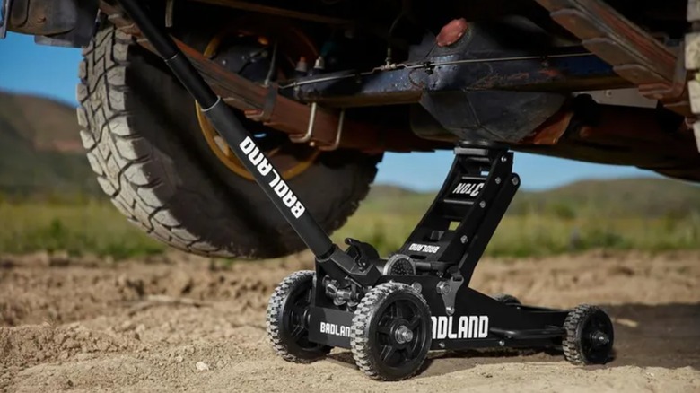 lifting car while on dirt road with Badland jack