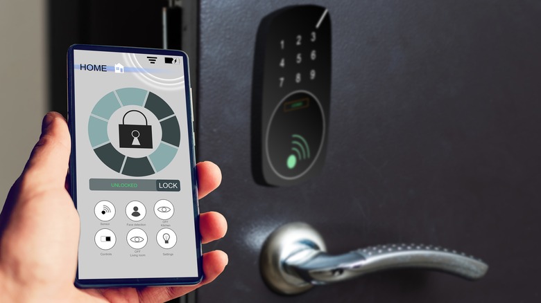 A smart lock being opened by a smartphone