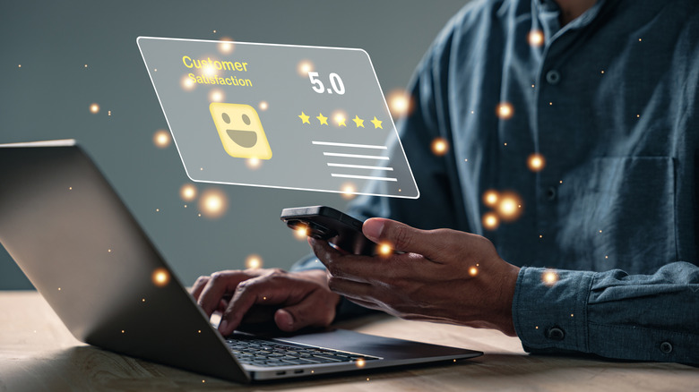 Holographic image of customer satisfaction box with five stars.