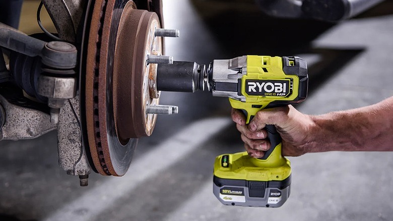 Using impact wrench to tackle large lugs in a vehicle.