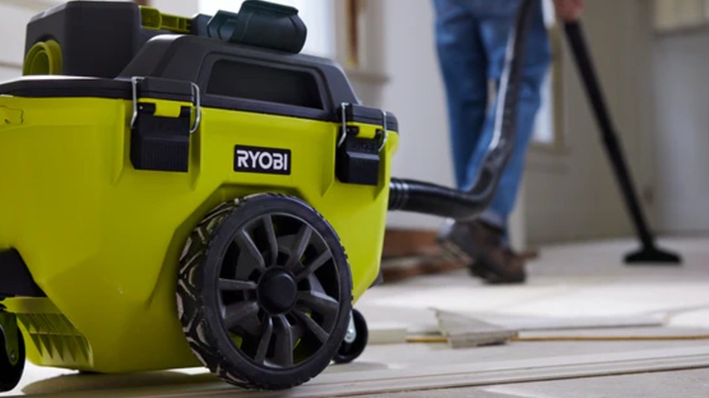 Ryobi wet/dry vac in action on a worksite floor