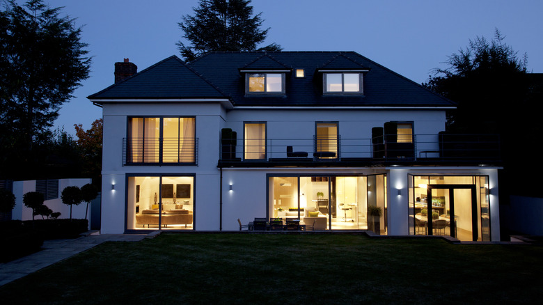 Home illuminated from the inside at dusk