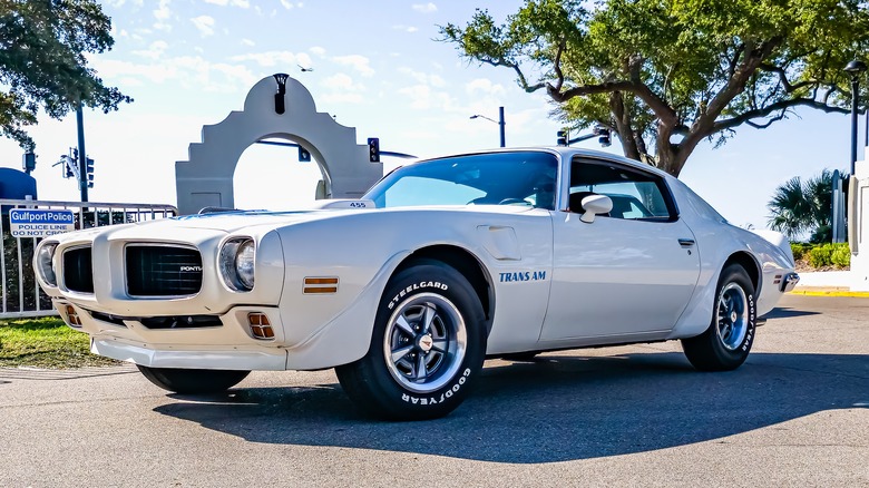 A white Pontiac Firebird Trans Am at a local car show