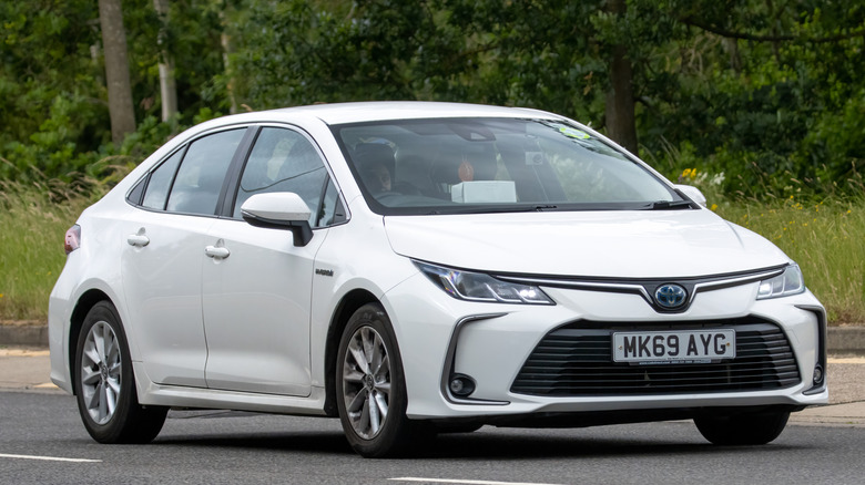 White Toyota Corolla on the road