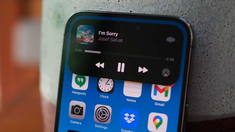 iPhone 14 with song on screen