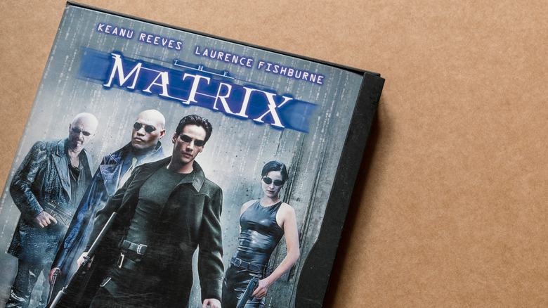 The Matrix DVD lying on a background