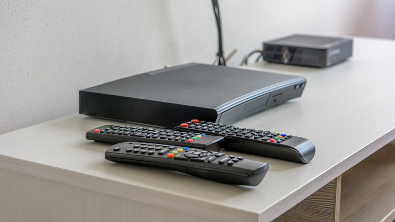 Media device player and remotes on a stand