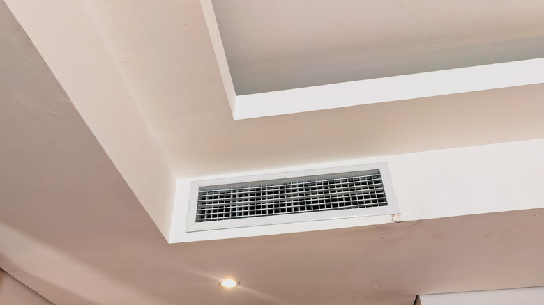 Air conditioner vent within a vaulted ceiling