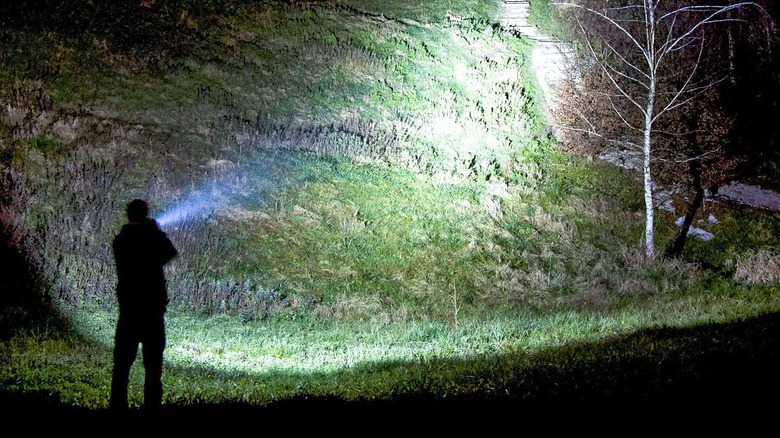 Person using a Lighting EVER flashlight