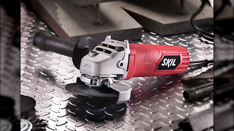 Skil angle grinder on metal bench