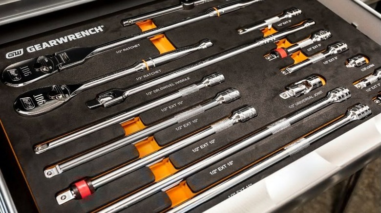 Assorted GearWrench ratchet and drive tools in a foam tray