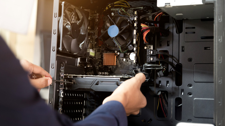 A person upgrading a desktop PC