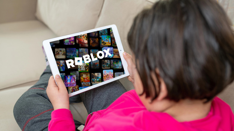 Child holding an iPad