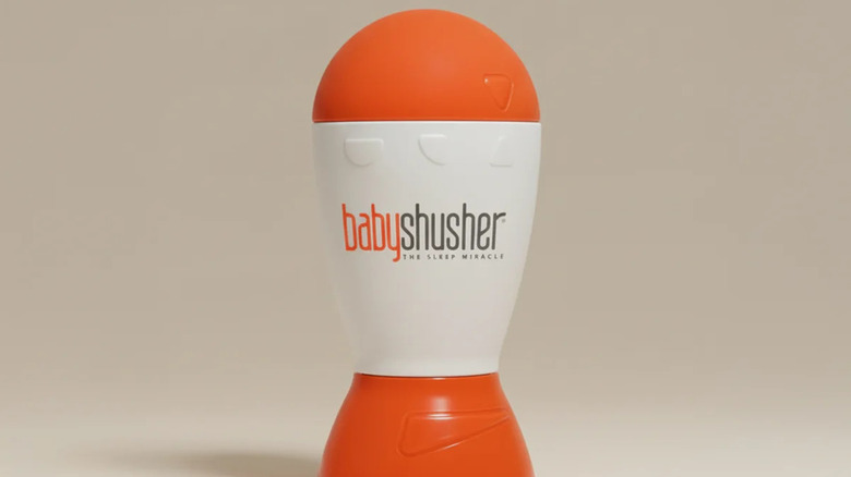 The Baby Shusher Portable Sound Machine on a beige background