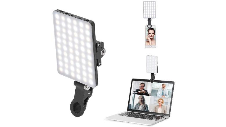 Three Newmowa Clip Fill Video Conference Lights on a white background, one of them attached to the top of a phone and another on top of a laptop