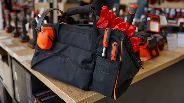 A black hardware store tool bag