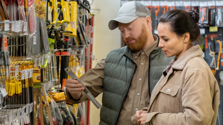A couple shopping for tools together