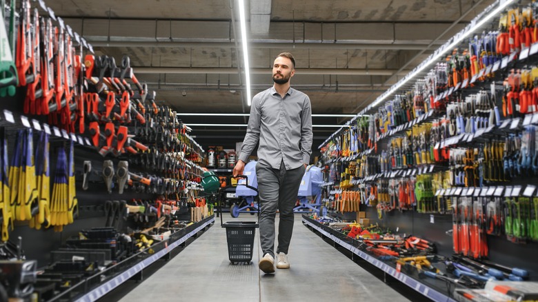 A man shopping in a hardware store