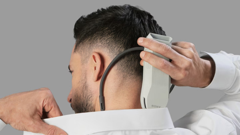 A person using the Sony Reon Pocket with a shirt