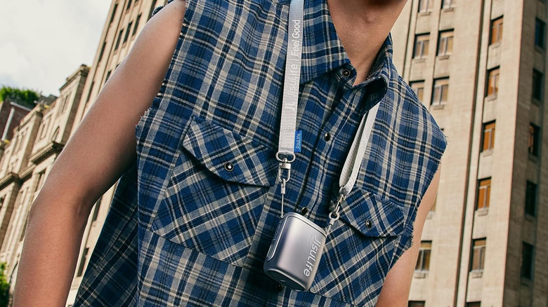 Jisulife portable neck fan around the person's neck