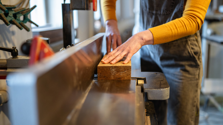 squaring up a board on a jointer