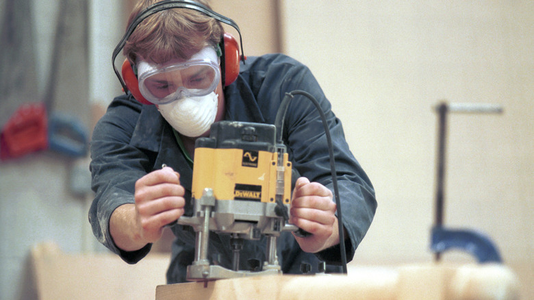 woodworker using a router
