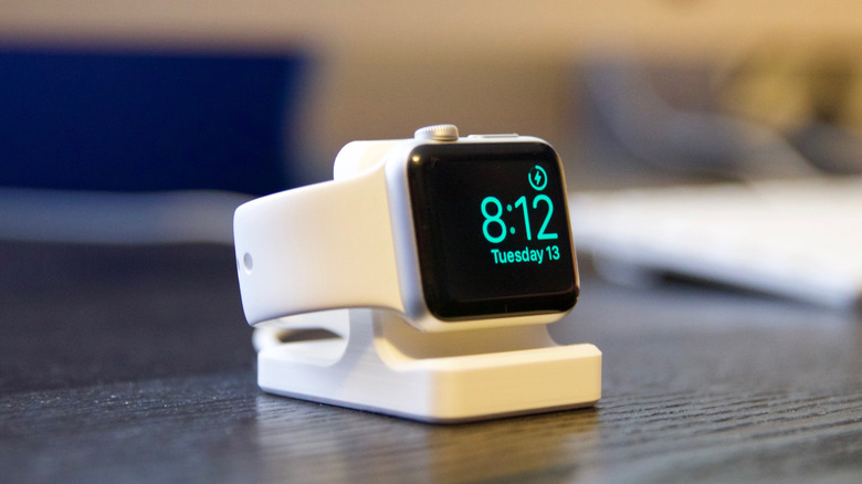 Printed charging stand on desk with Apple Watch mounted and charging