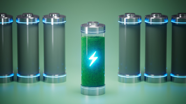 A row of 3D modeled batteries, one with a glowing lightning bolt