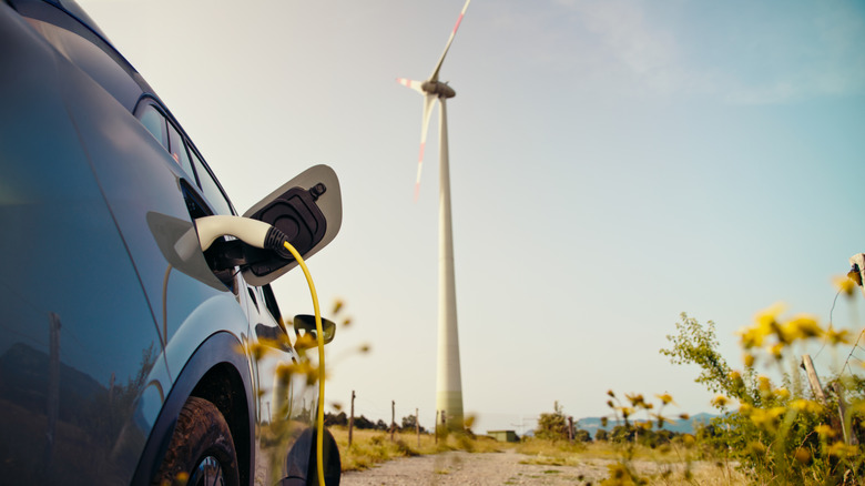 An EV charging at a charging station