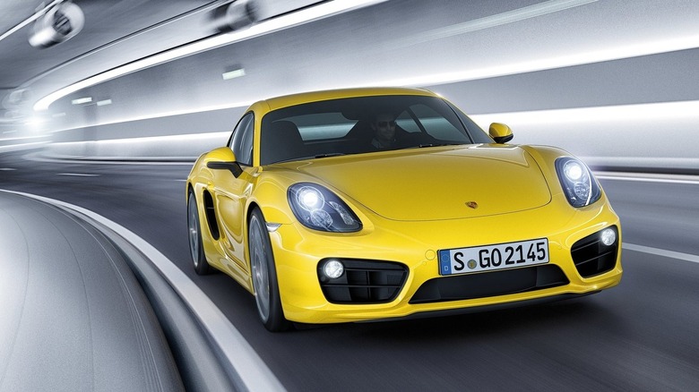 Porsche Cayman driving through a tunnel