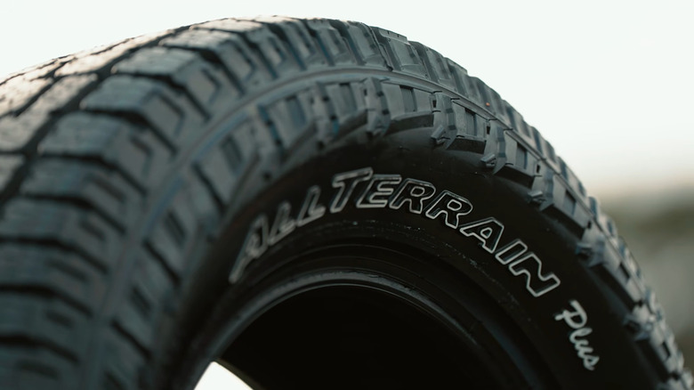 A Pirelli Scorpion AT Plus tire on display