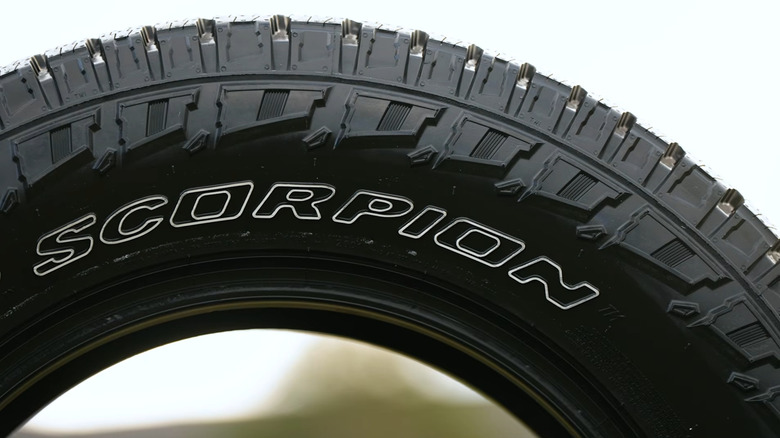 A Pirelli Scorpion AT Plus tire on display