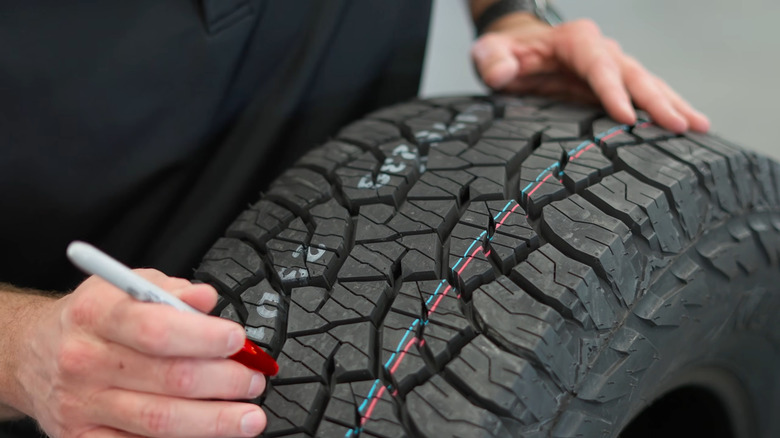A Kumho Road Venture AT52 tire on display