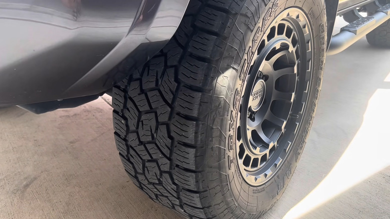 A Toyo Open Country A/T III mounted on a vehicle