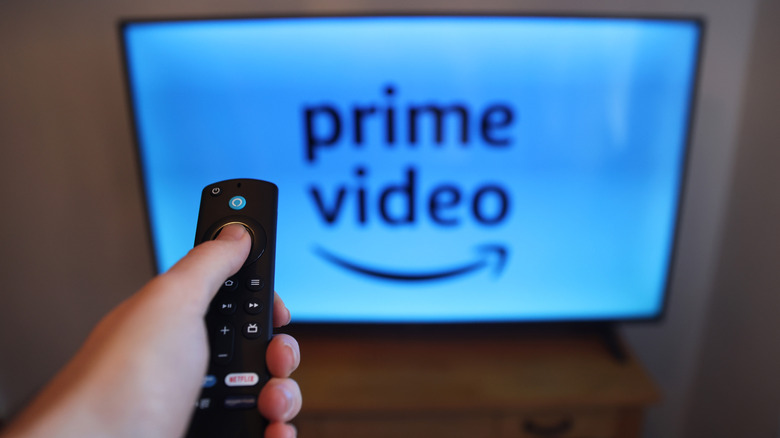 Firestick remote with television in background