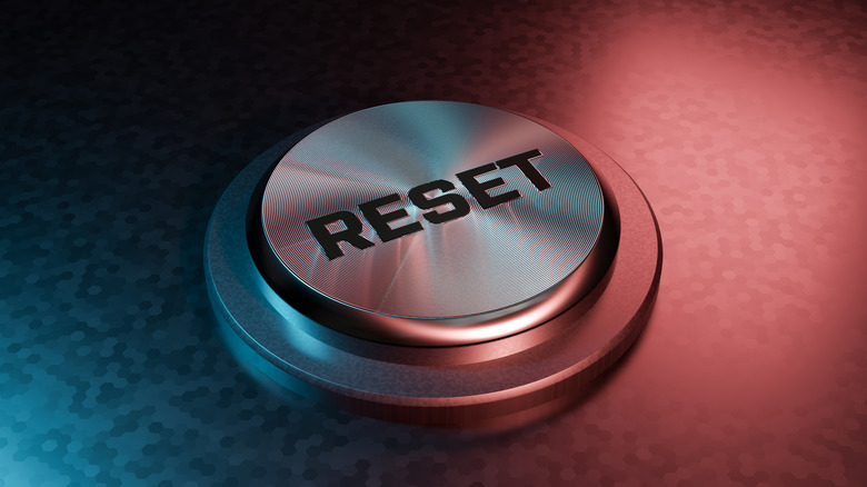 Reset button close up with blue and red lighting
