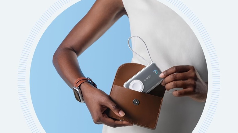 A person keeping an Anker MagGo power bank inside a bag